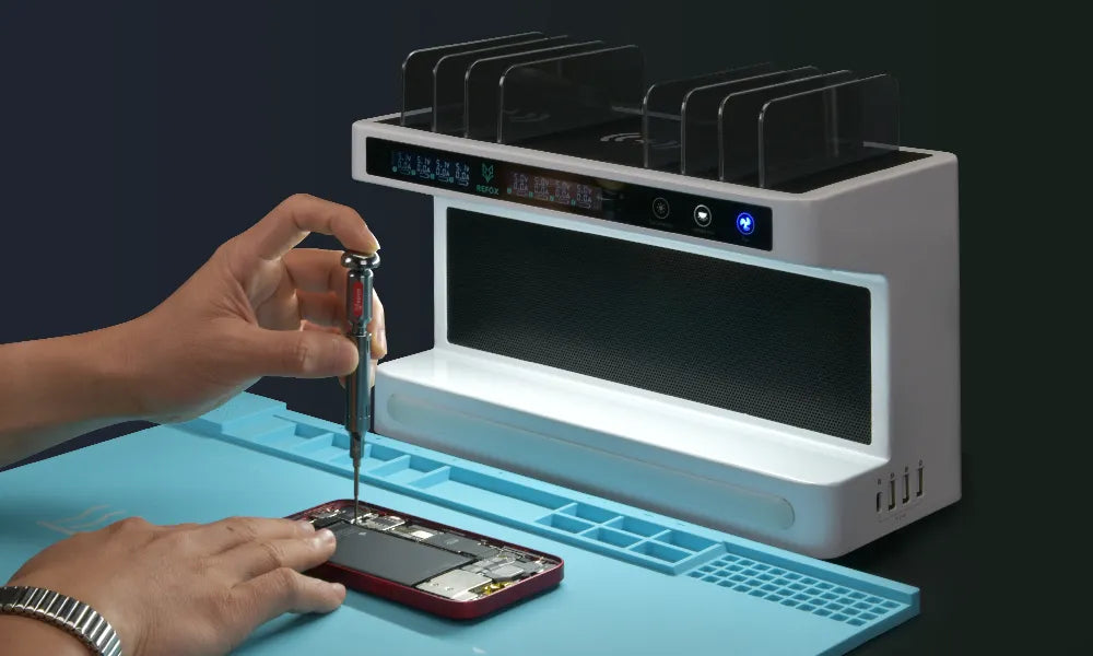 Person repairing a smartphone using a UV light with a digital display