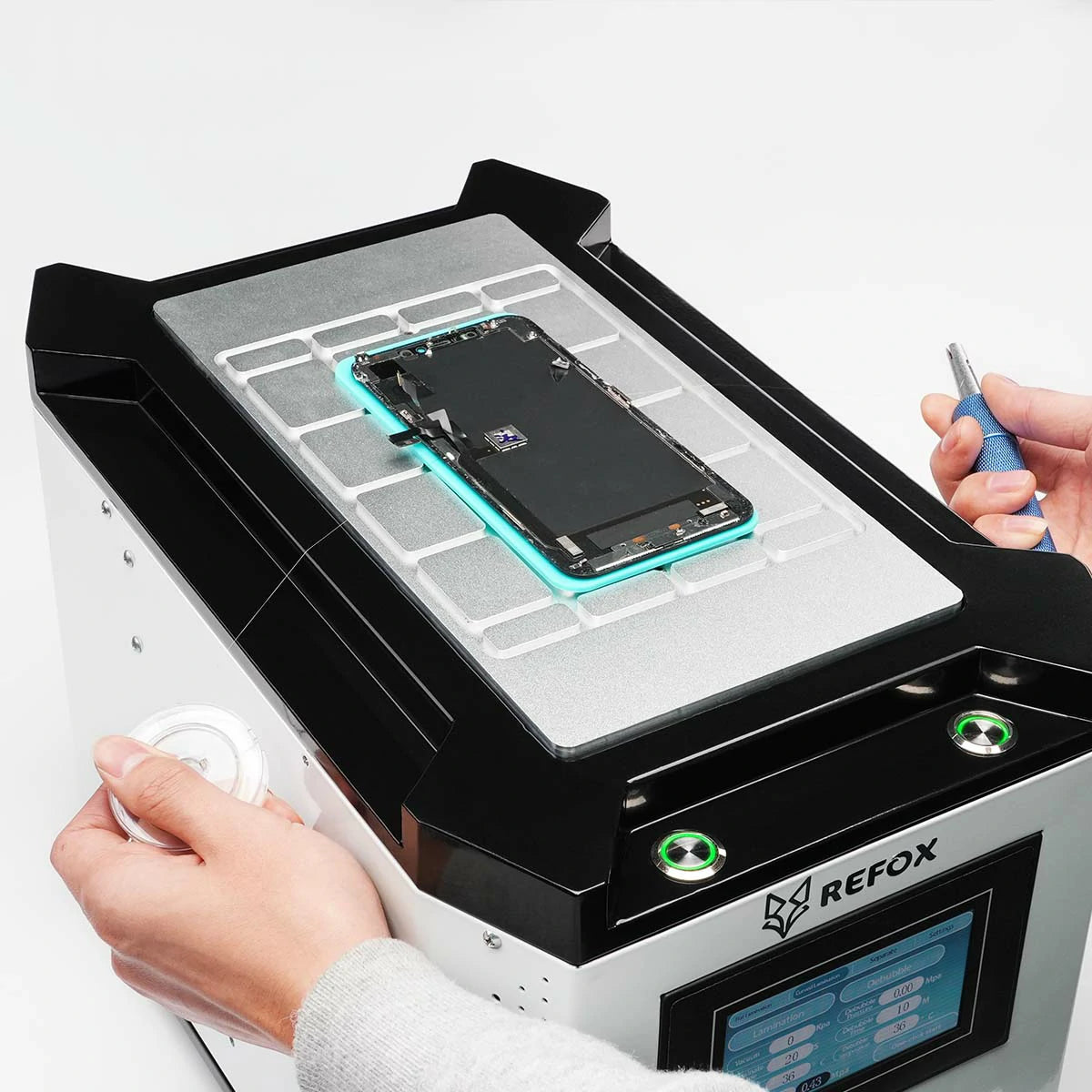 Person working on a smartphone with a REFOX device on a white background