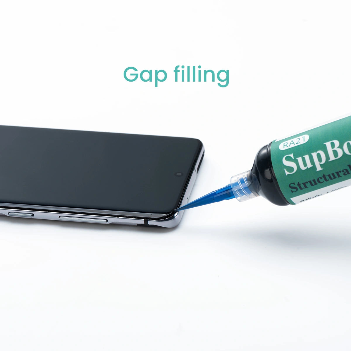Tube of Superglue being used to fill a gap on a smartphone