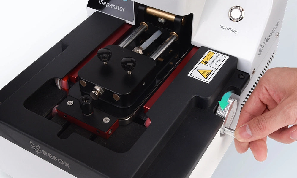 Hand using a tool on a REFOX device with a white background