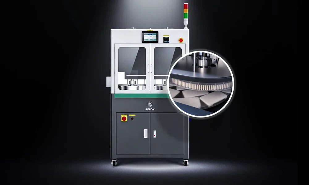 A large REFOX AP25 polishing and grinding machine with a white upper cabinet, dark gray lower cabinet, and a circular inset showing a close-up of internal components. The brand name 'REFOX' is visible on the front.