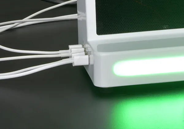 Electronic device with green light emitting diode (LED) on a dark surface