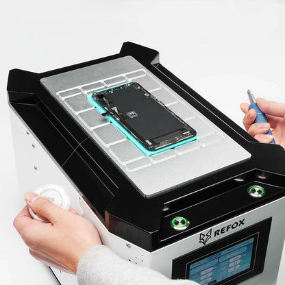 Person working on a smartphone with a REFOX device on a white background