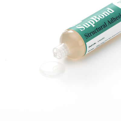 Tube of SupBond Structural Adhesive on a white background