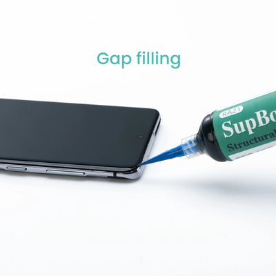 Tube of Superglue being used to fill a gap on a smartphone