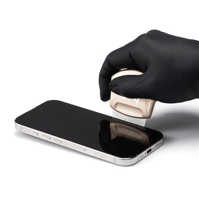 Hand wearing a black glove opening a smartphone screen on a white background