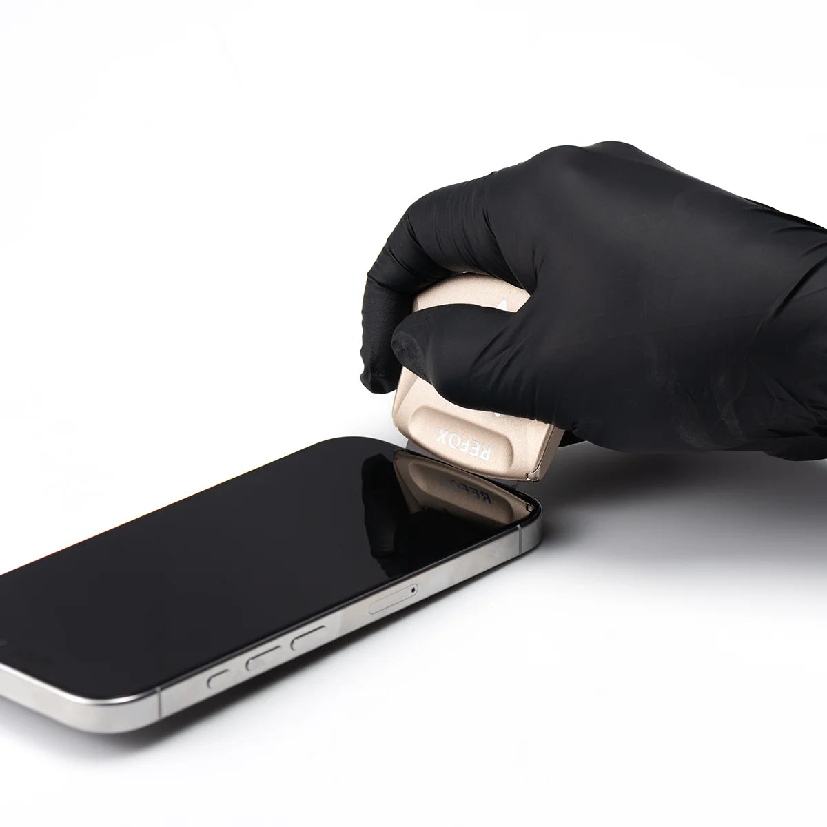 Person opening a smartphone screen with a black glove on a white background
