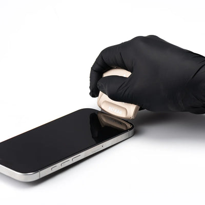 Person opening a smartphone screen with a black glove on a white background