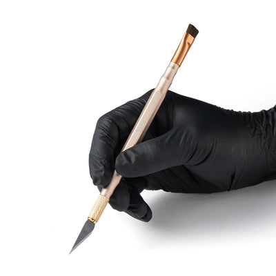 hand holding refox rs75 knife holder on a white background