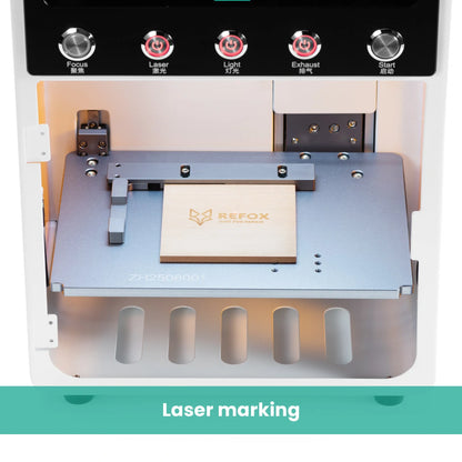 Laser marking machine with a business card on a platform, featuring the REFOX logo.