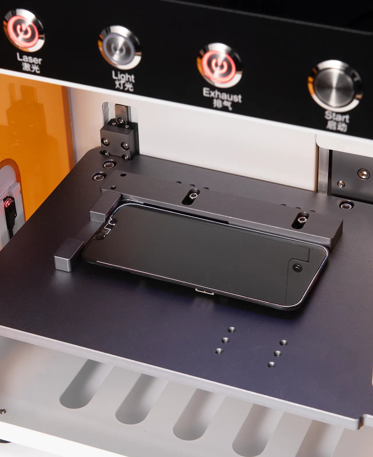 Control panel of a rk10 machine with buttons labeled 'Laser', 'Light', 'Exhaust', and 'Start'.