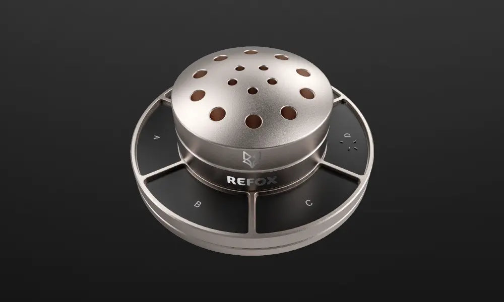 Silver kitchen exhaust hood with 'REFOX' branding on a black background