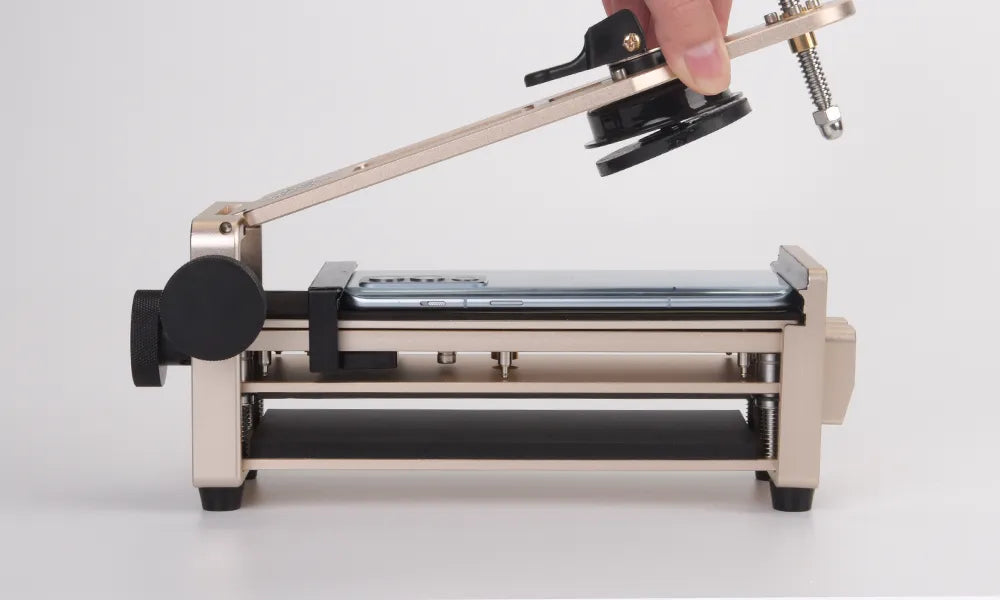 Glass separation machine with a hand holding suction cup on a white background