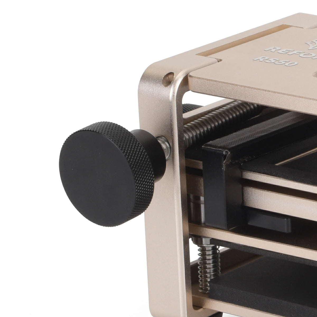 Close-up of a rs50 with a black knob on a white background